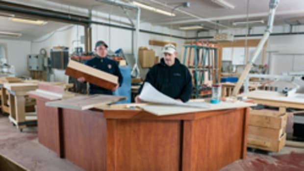 Rich Davis (white hat) and Jeremy Woods at Hawk Hill Cabinetry’s shop in Brandon, Vt., which produces kitchens, bathrooms and a whole lot more.