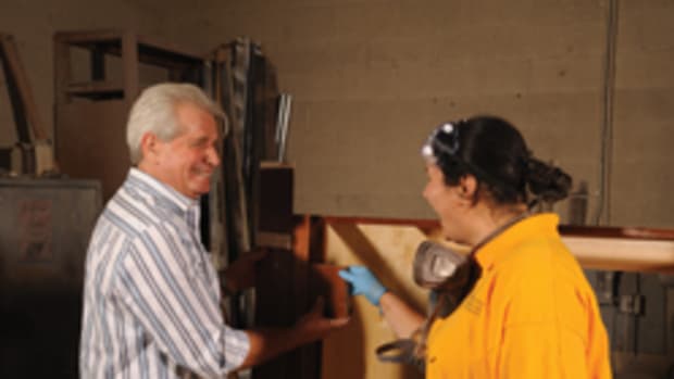 Jacob Dorenbaum (left) share a light moment with an employee at Custom Design Cabinets in Las Vegas.