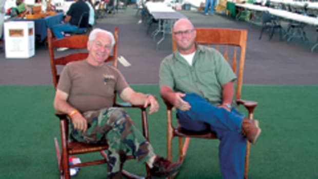 John Morris (right) with fellow furniture maker Russ Filbeck. Morris oversees the website that raises awareness about disabled veterans throughout the U.S.