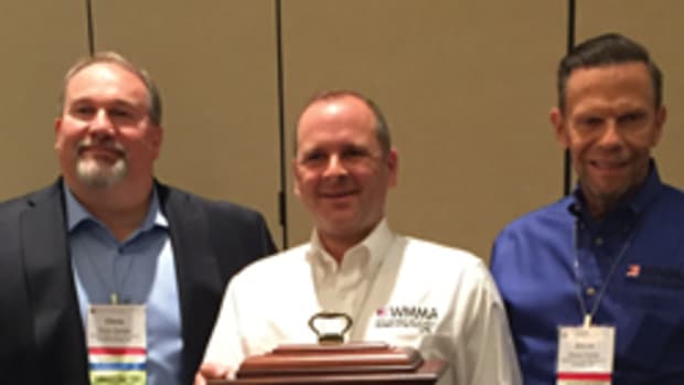 Jamison Scott receives the 2017 Ralph P. Baldwin award from WMMA president Chris Hacker (left) and vice president Steve Carter.