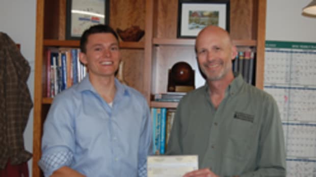 NESAW director Greg Larson (right) with student scholarship winner Jake Cazja.