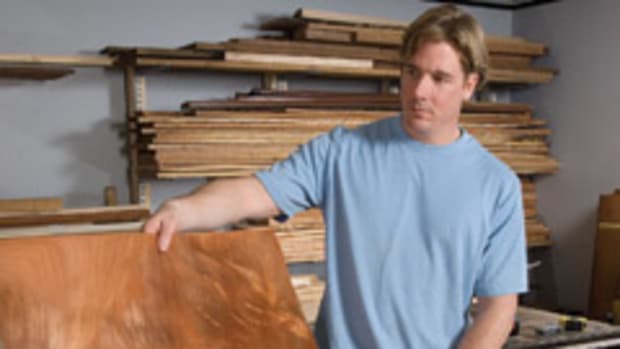 Thomas McDonald of Canton, Mass., owner of Thomas McDonald Fine Furniture checks out pieces from a wild flitch of veneer.