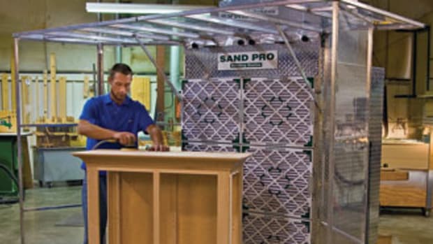 The Sand Pro sanding booth, model SB108, features hinged vinyl sides and top panels to construct the best perimeter for your workpiece, up to 9' wide.