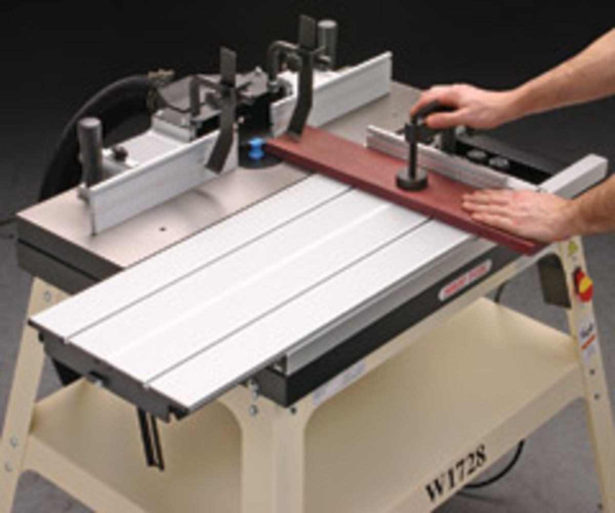 The Shop Fox W1728 router table includes a 31" x 12" sliding table with a clamping miter gauge.