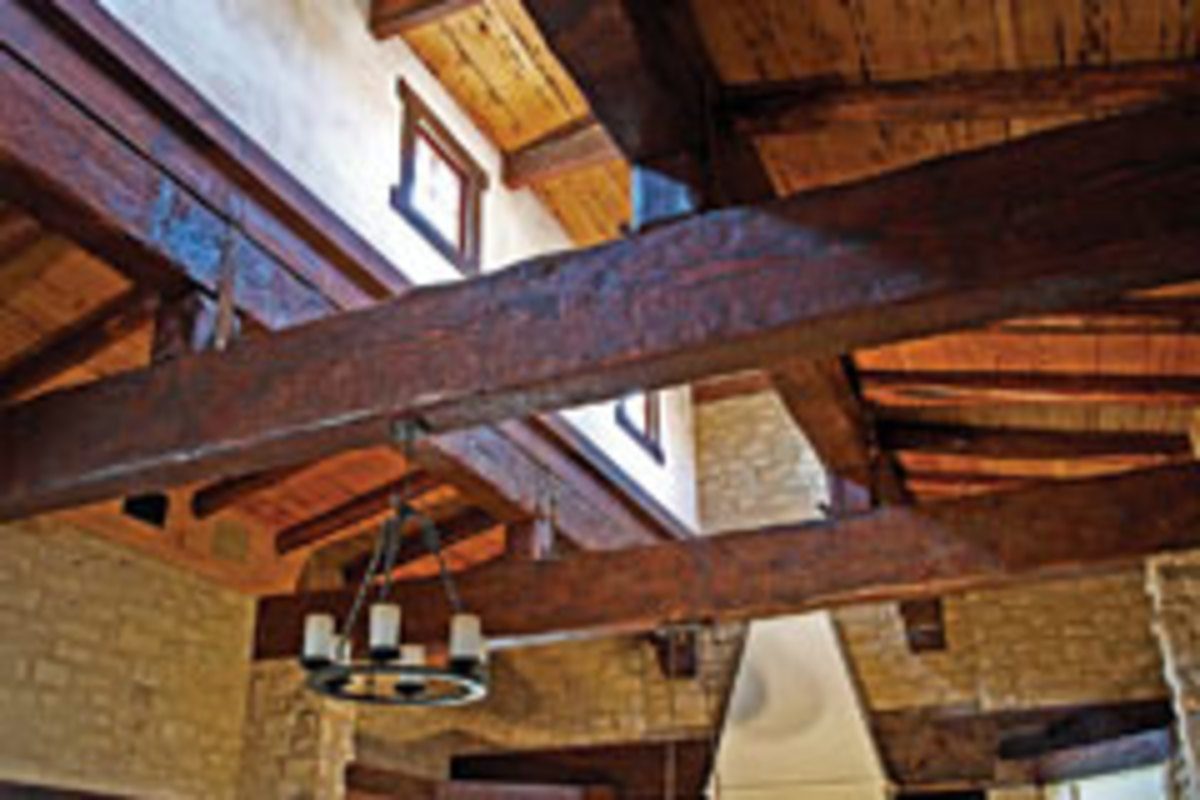 Tule Peak recycles hand-hewn Douglas-fir beams, cedar ceiling panels and black oak window trim to create a Tuscan look in this custom home.