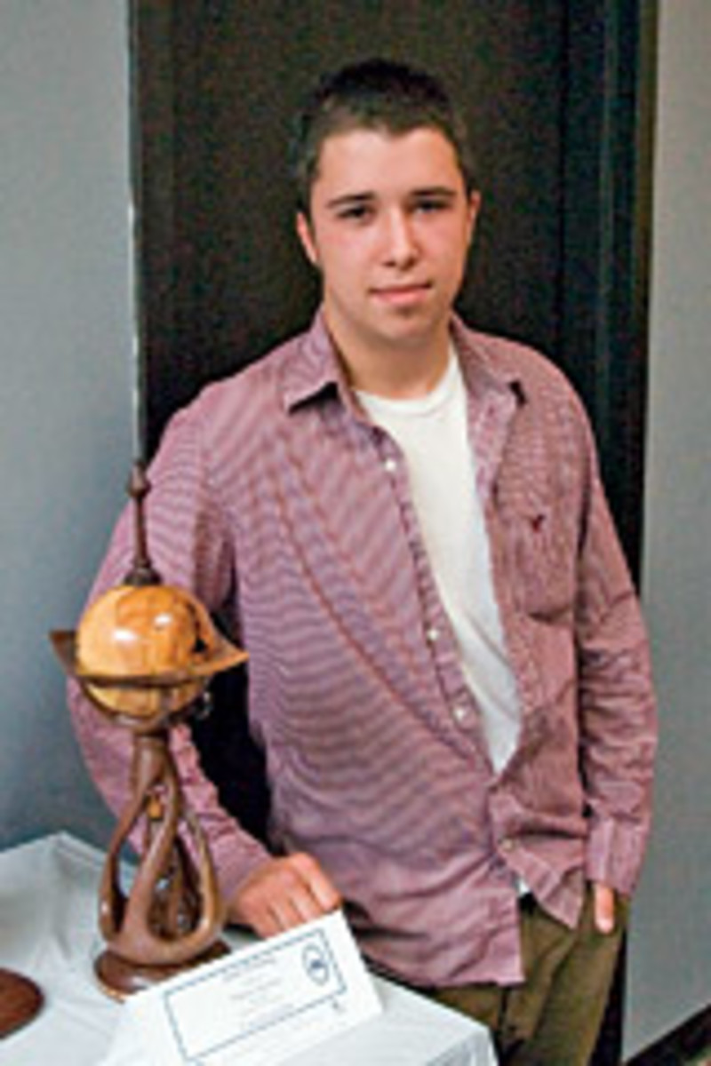 Justin Doherty and his winning entry in the New England Student Woodworking Design competition.