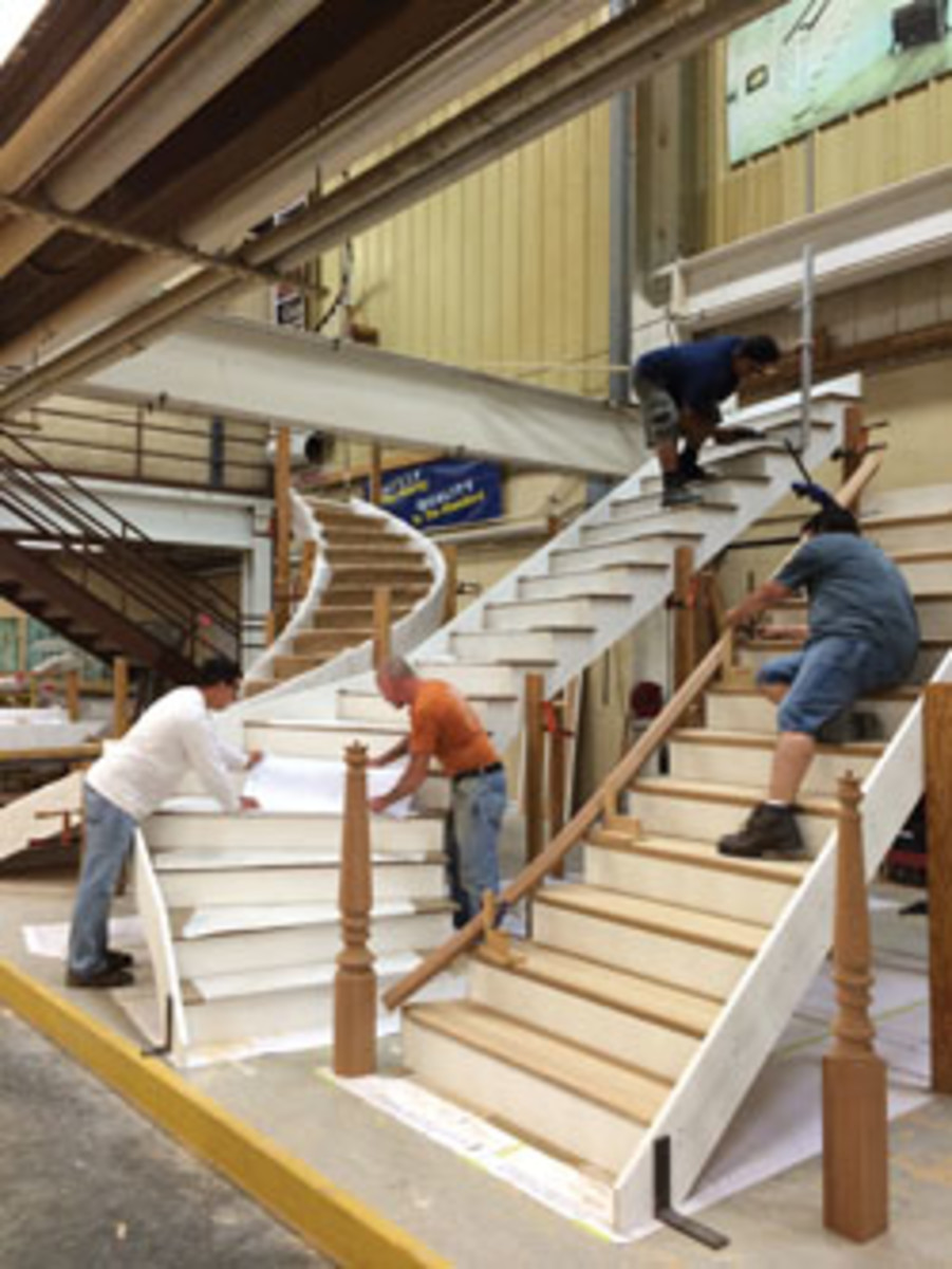 It's all hands on deck as two staircases are assembled in the shops mockup area.