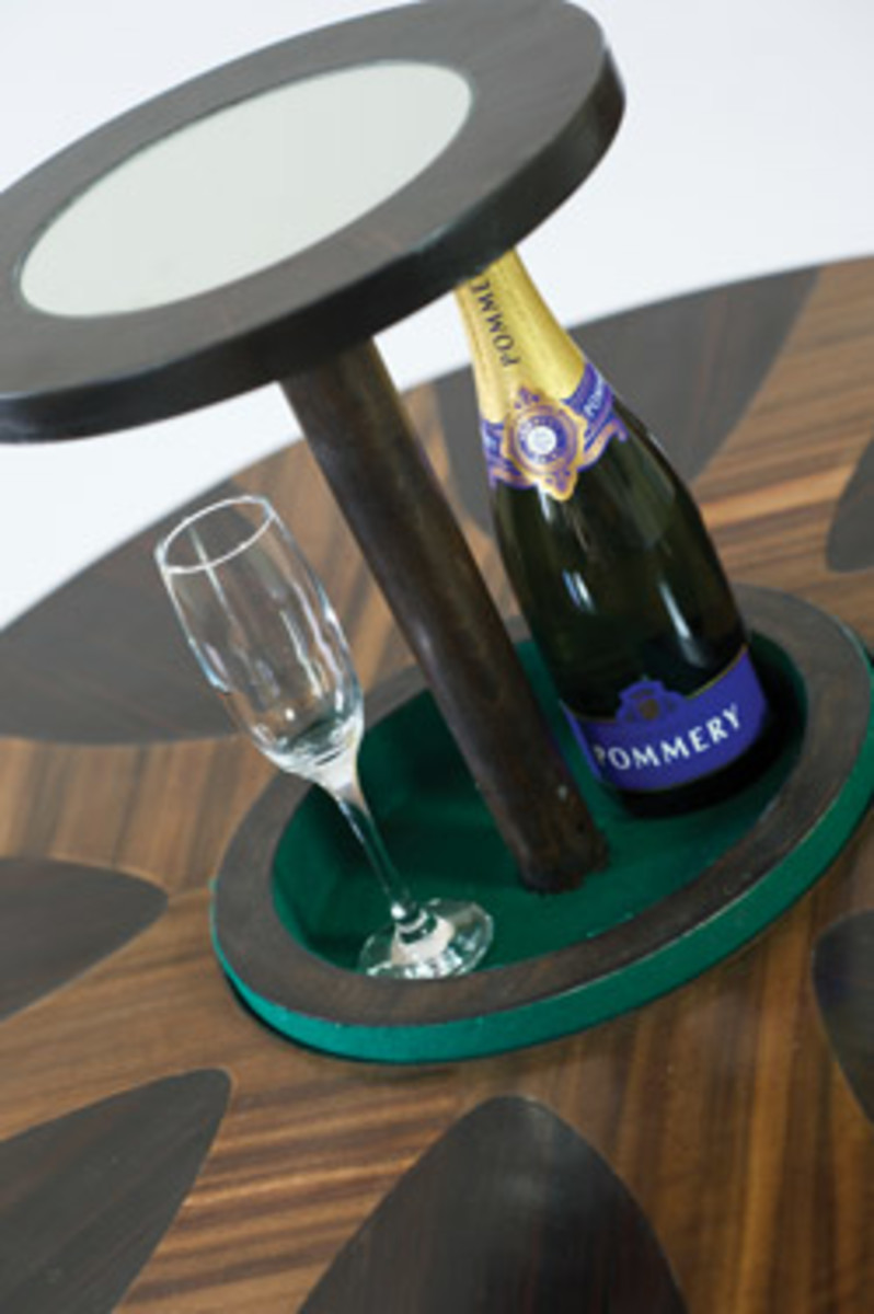 Shane Elliot's "Prohibition Table" retracts at a push of a button to hide the alcohol.