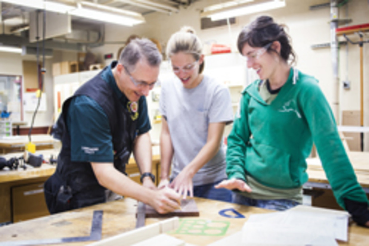 Patrick Molzahn works with students in his cabinetry and millwork program at Madison Area Technology College.