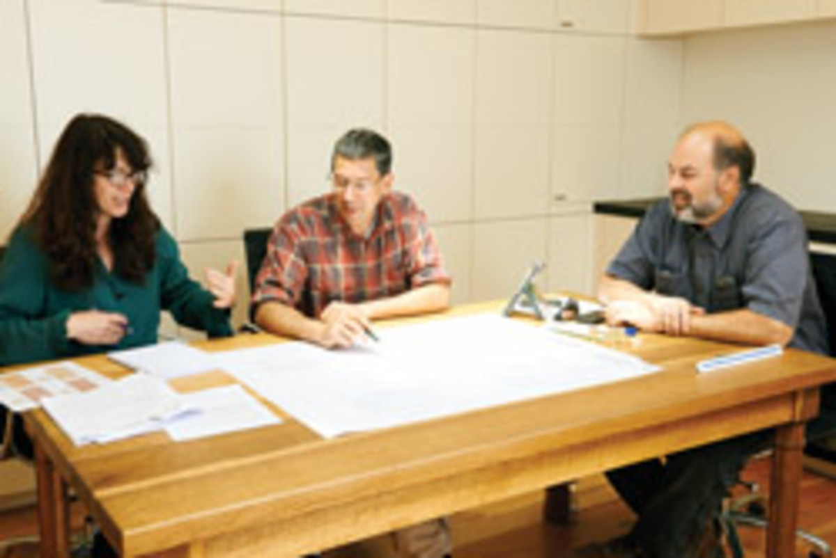 From left, Gale Melton, Seidman and Lido Martocchio discuss the details for an upcoming project.