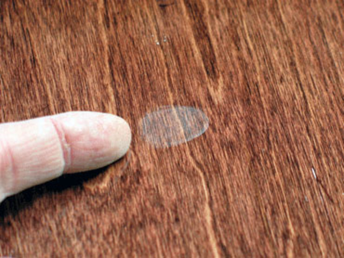 When finishes dry slower than expected, press marks, like the one shown here with a fingerprint, are often the result.