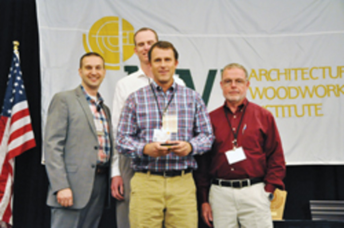 Stephenson Millwork leaders accept the overall Standard of Excellence Award at the AWI conference.