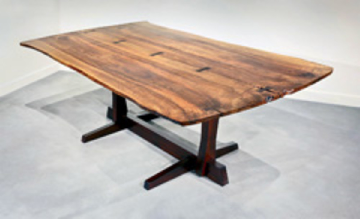 Nakashima dining table made of Persian walnut and matched with rosewood butterflies (1971).