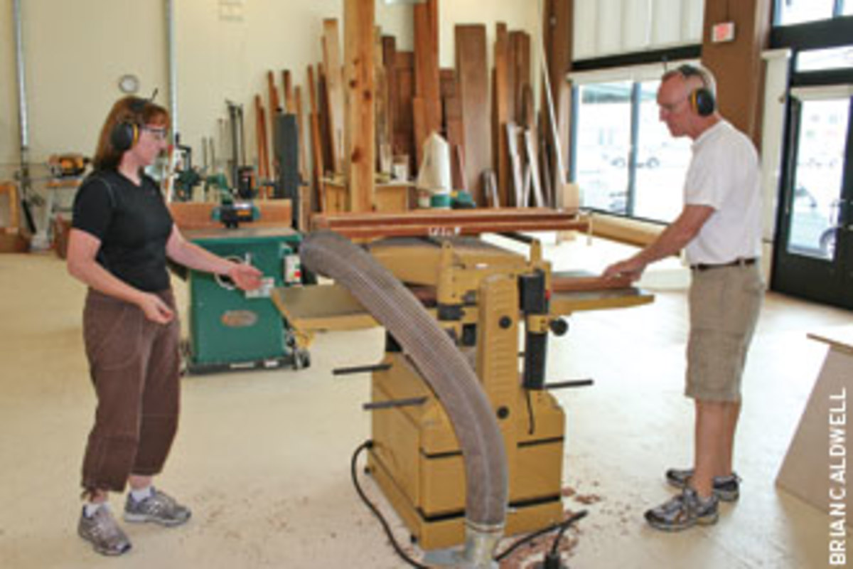 Alison Swan-Ingram, left, and Carl Johnson work together at Franklin Street Fine Woodwork in Tampa, Fla.