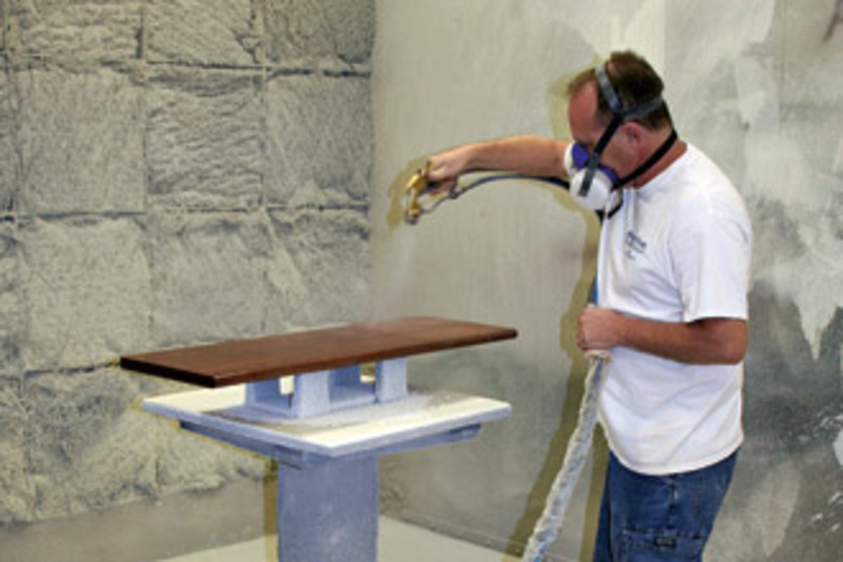 Lead finisher Jeff Neeley works in one of the 10' spray booths at The Burkhart Co., in Louisville, Ky.