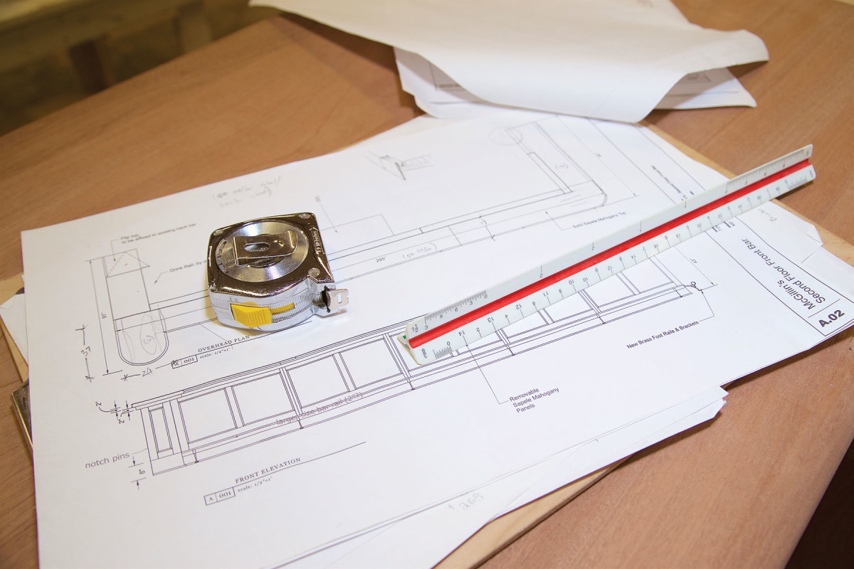 Photo of blueprint and measuring tape