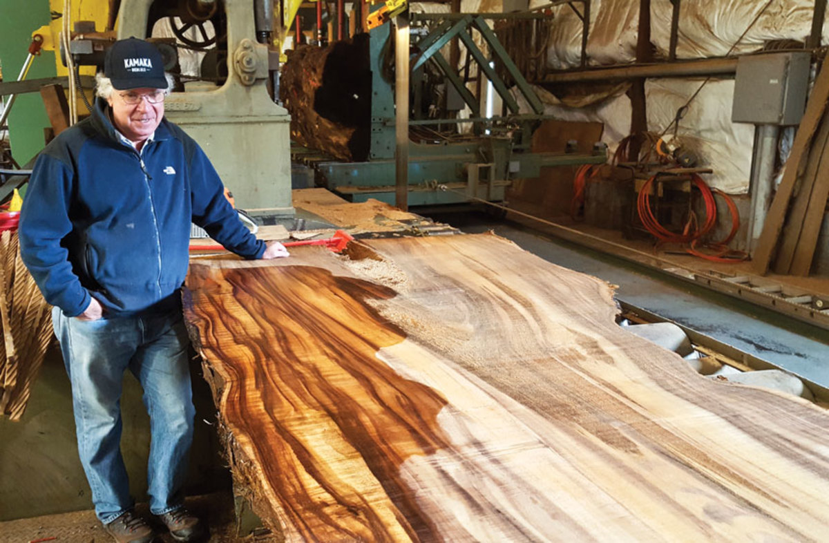 Rick Hearne with koa wood slab.