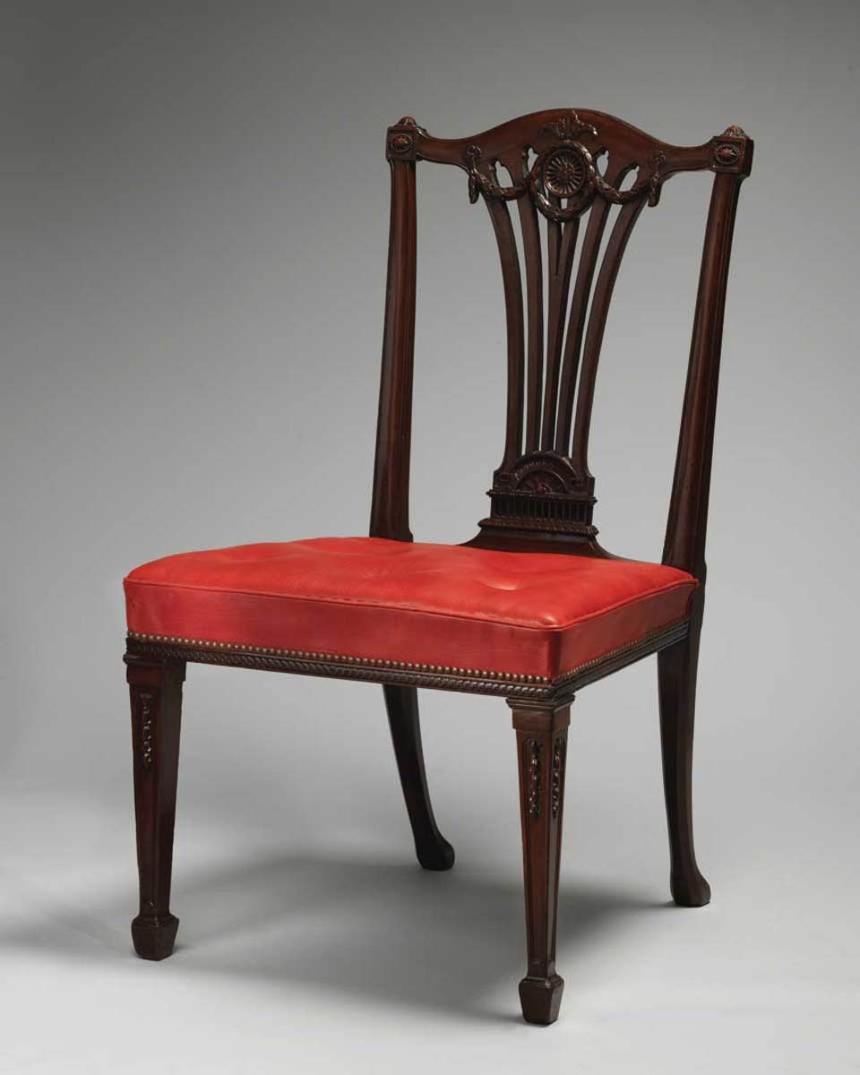 One chair from a set of 14 side chairs by Thomas Chippendale, circa 1772, made of mahogany and covered in morocco leather. 