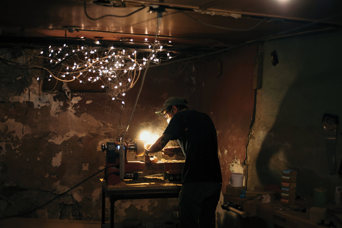 Colin Pezzano working in his basement shop