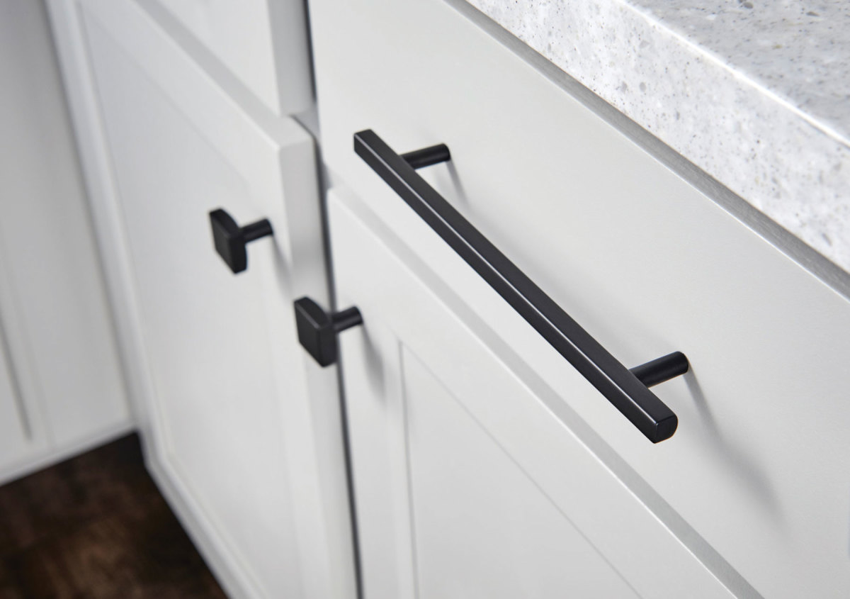Kitchen by HighCraft Cabinets featuring the trendy use of knobs and pulls.