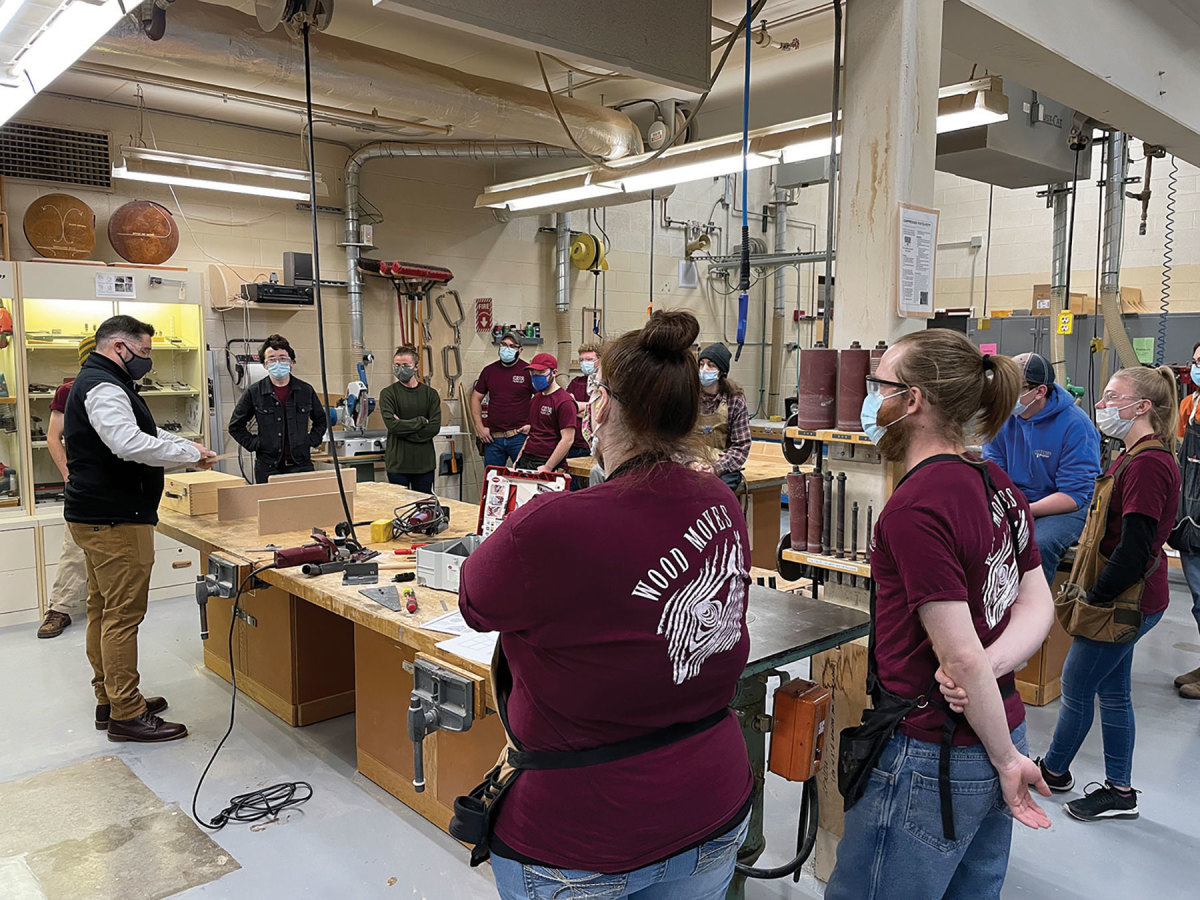 Students from Madison Area Technical College get hands-on experience with the Lamello     biscuit joiner and P-System connectors.