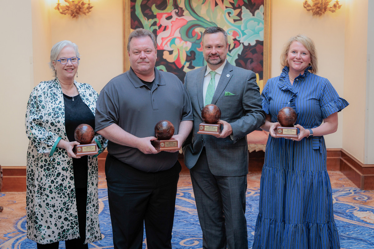 Peggy Anderholm from Marvin, Ron Devillez from National Office Furniture (a 2020 winner); Larry Combs from Brown-Forman and Katie Junk from Crestwood at the awards ceremony.