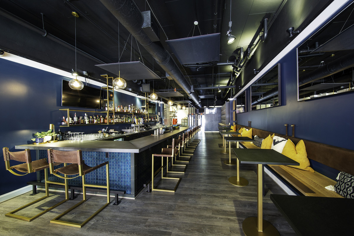 Kerf & Burled designed and fabricated the bar, bar top, stools, wall-mounted benches and leather cushions, tables and bourbon locker for Stem, a bar in Winston-Salem, N.C.