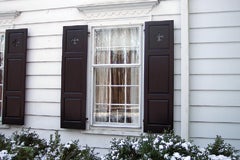 beech-river-mill-produced-these-raised-panel-shutters-with-a-decorative-cutout-and-for-this-home-in-manchester-by-the-sea-mass.jpg