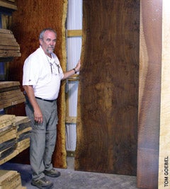 corlis-with-some-prized-wood-slabs.jpg