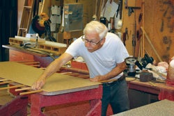 alonzo-taylor-glues-a-laminate-countertop-at-custom-woodwork-inc.jpg
